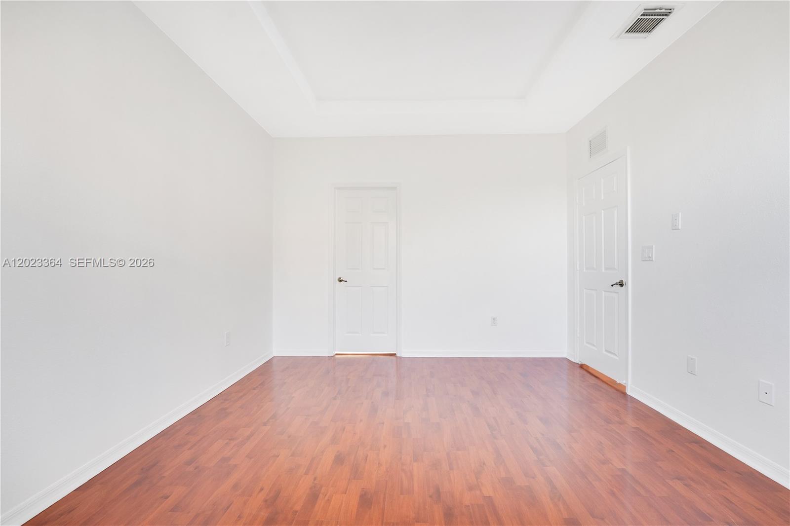 27433 Southwest 137th Court, Unit 1 Homestead, FL 33032 - Photo 17 of 28 a view of a room with wooden floor