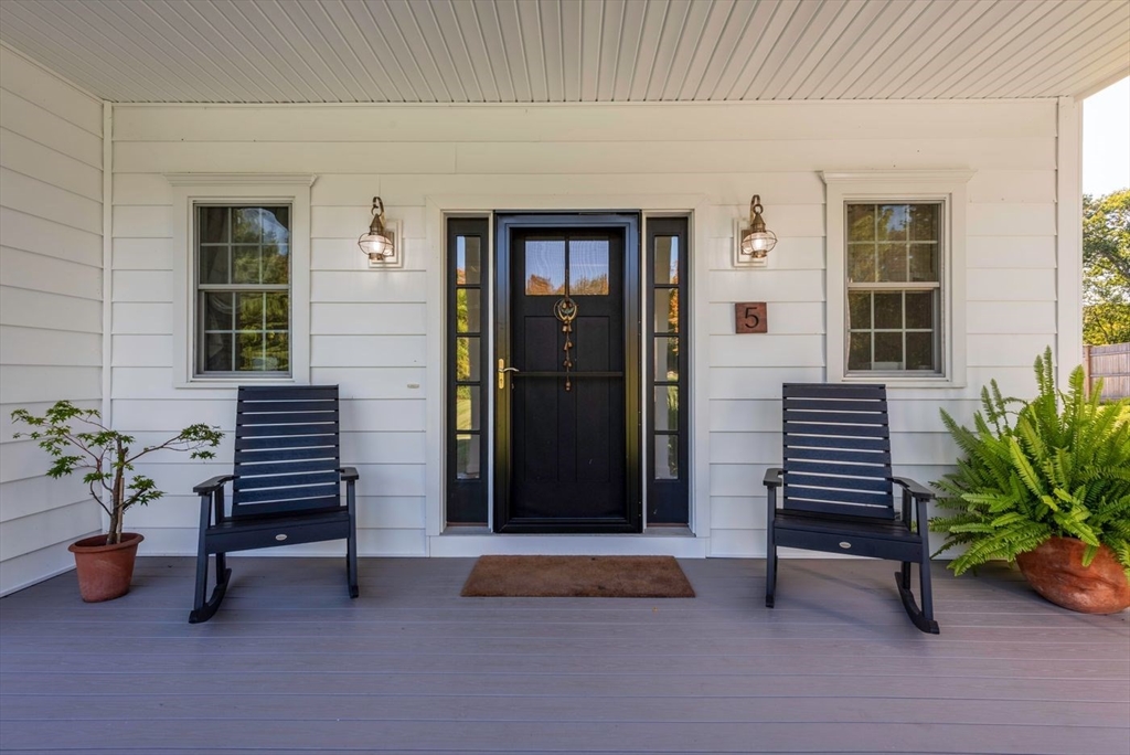 5 John West Road Exeter, NH 03833 - Photo 4 of 33 a view of a patio with chairs and a potted plant