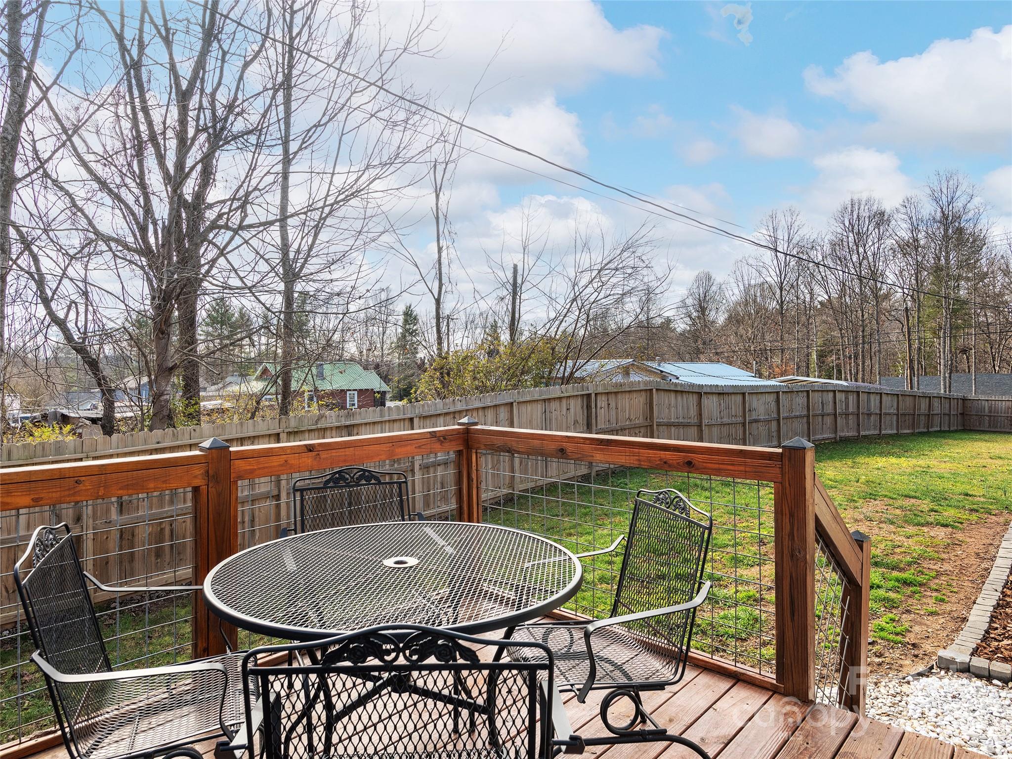 508 Fanning Bridge Road Fletcher, NC 28732 - Photo 20 of 21 a view of a chairs and table in the patio