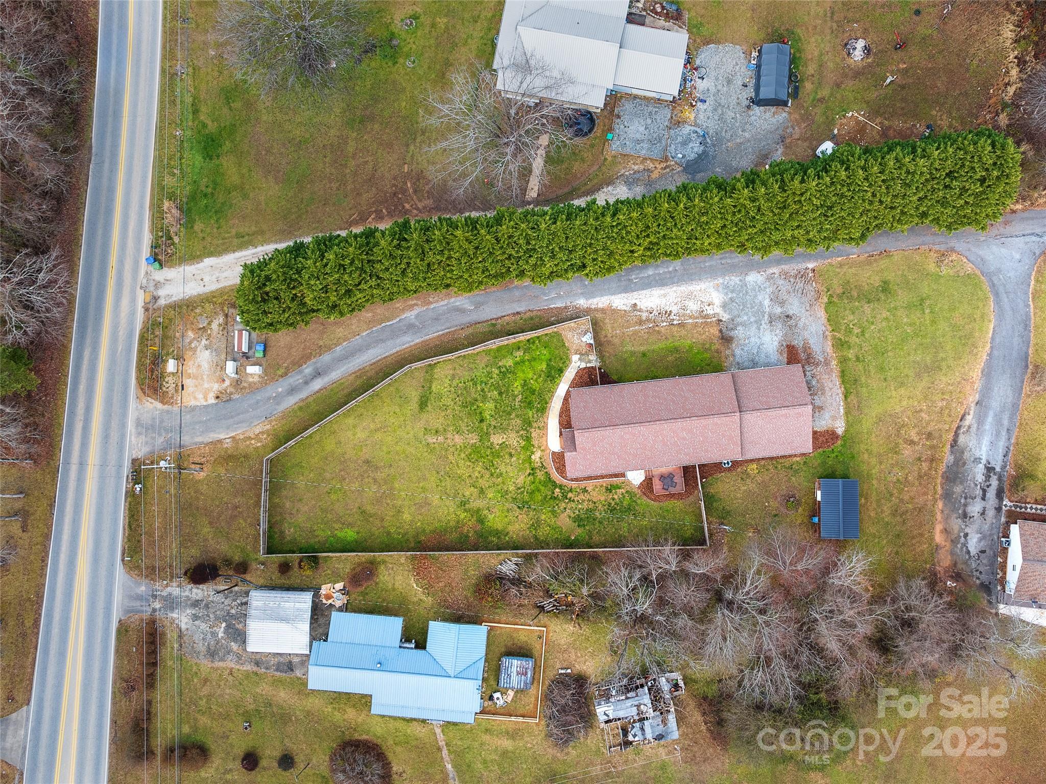 508 Fanning Bridge Road Fletcher, NC 28732 - Photo 4 of 21 an aerial view of a house with a yard basket ball court and outdoor seating