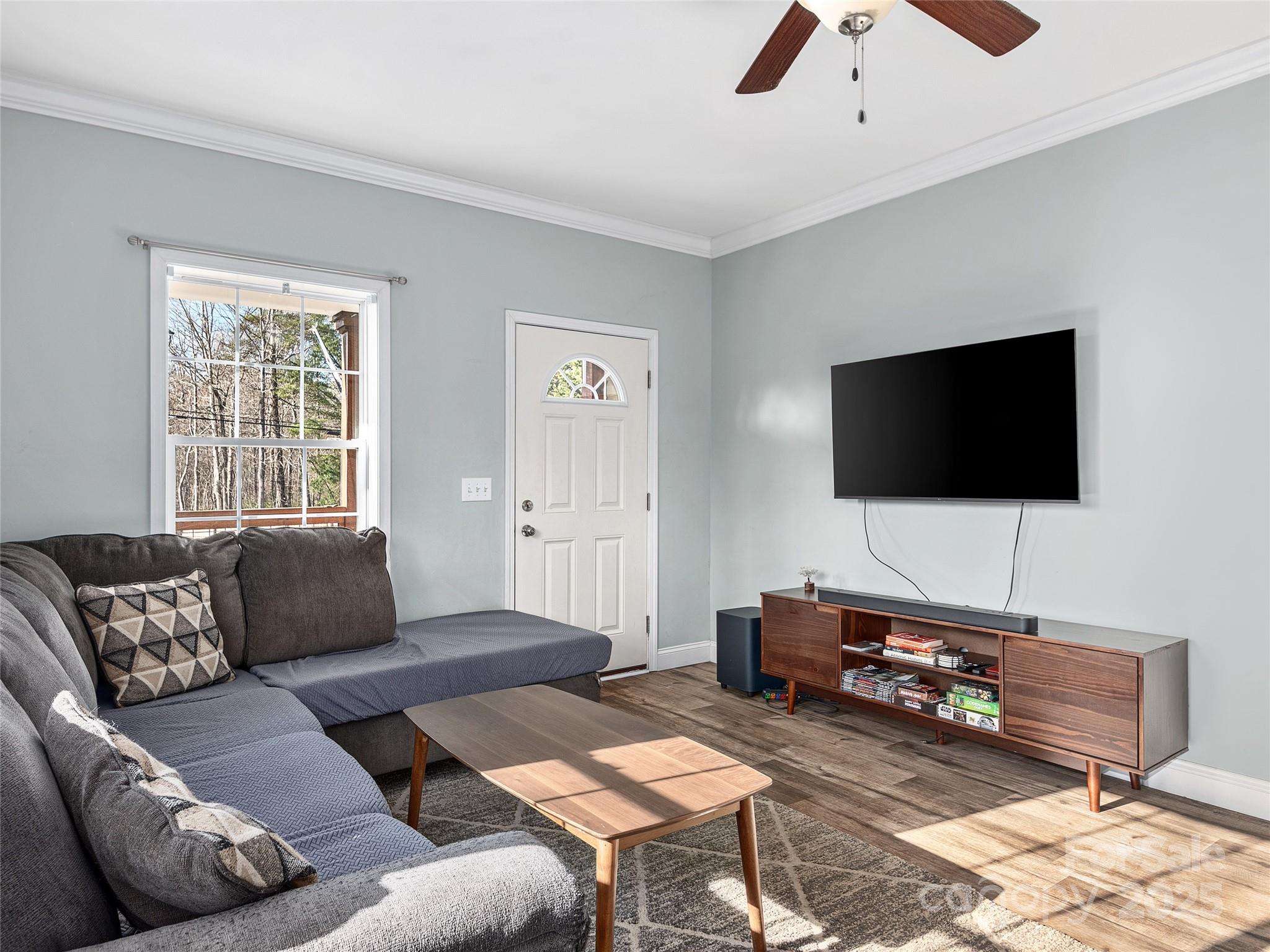 508 Fanning Bridge Road Fletcher, NC 28732 - Photo 5 of 21 a living room with furniture and a flat screen tv