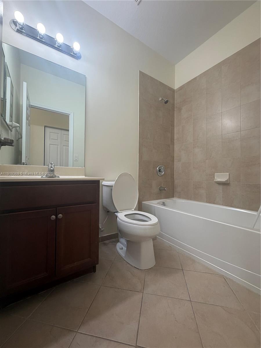 11347 Southwest 232nd Terrace Homestead, FL 33032 - Photo 21 of 26 a bathroom with a toilet sink and mirror