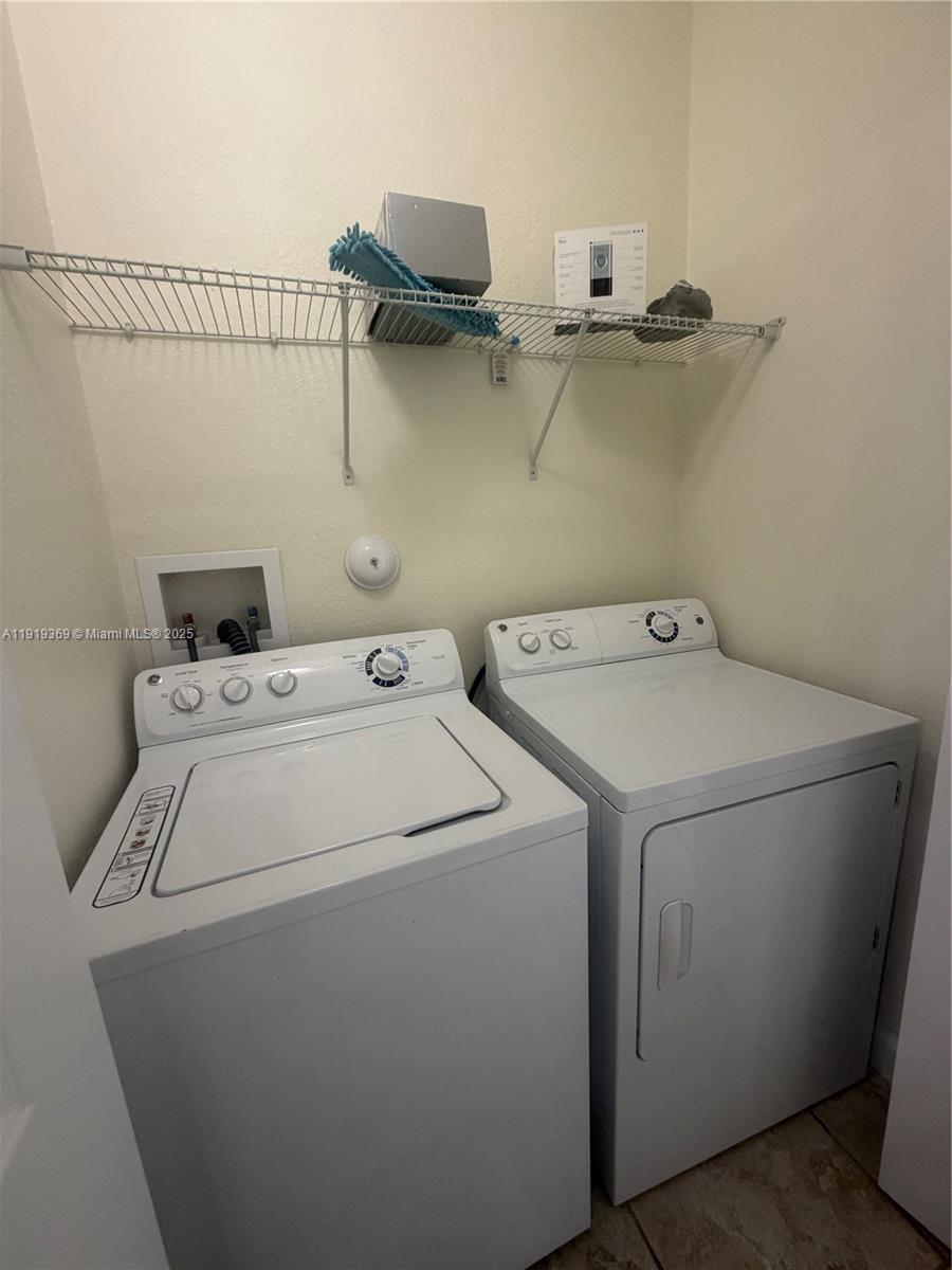 11347 Southwest 232nd Terrace Homestead, FL 33032 - Photo 23 of 26 a utility room with dryer and washer