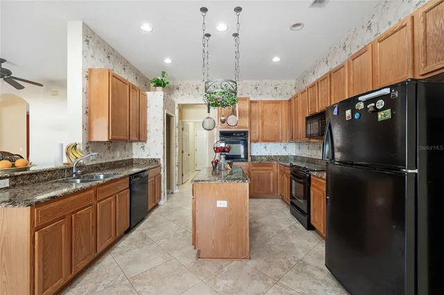 a kitchen with a refrigerator a sink and dishwasher