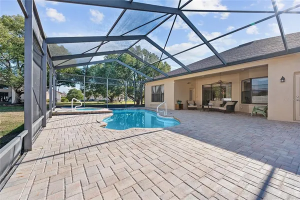 a view of a patio with wooden floor