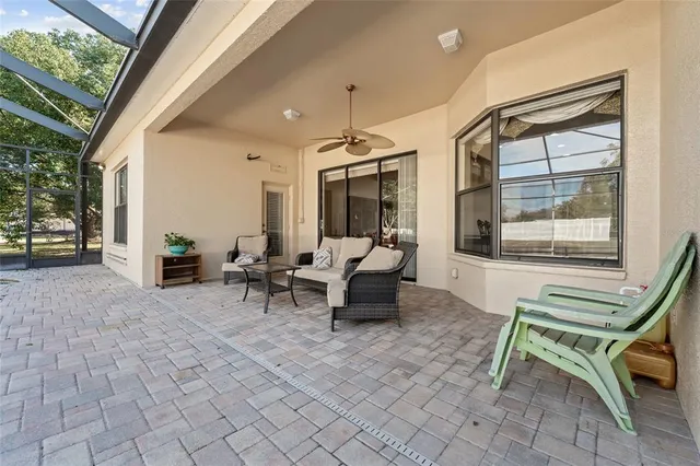 a outdoor space with lots of furniture and windows