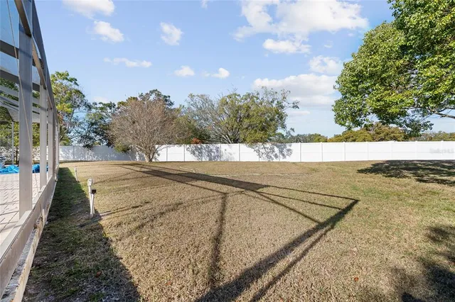 a view of a backyard of the house