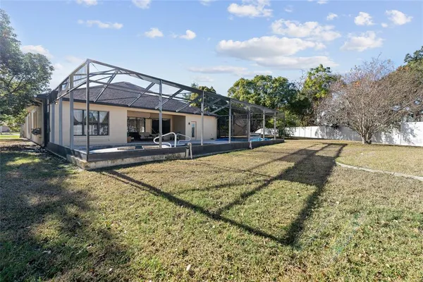 a view of a house with basketball court