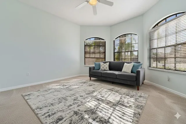 a living room with furniture and a window