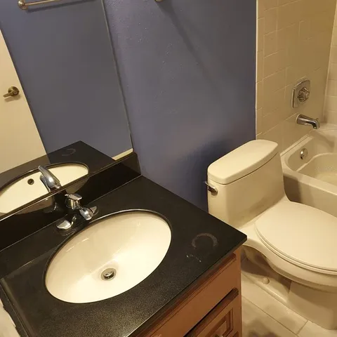 a bathroom with a sink and a shower