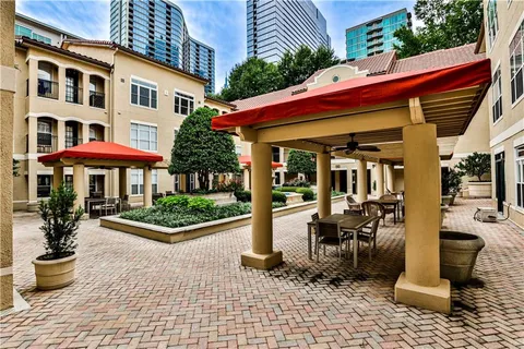 a front view of a building with sitting area