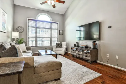 a living room with furniture and a flat screen tv