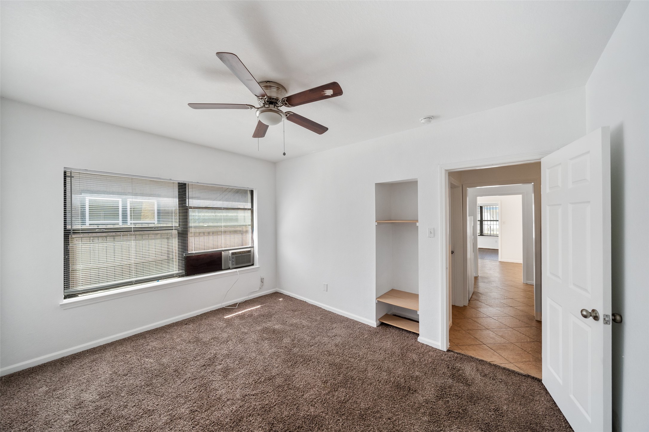 406 Quitman Street, Unit 2 Houston, TX 77009 - Photo 16 of 22 a view of empty room with wooden floor and fan