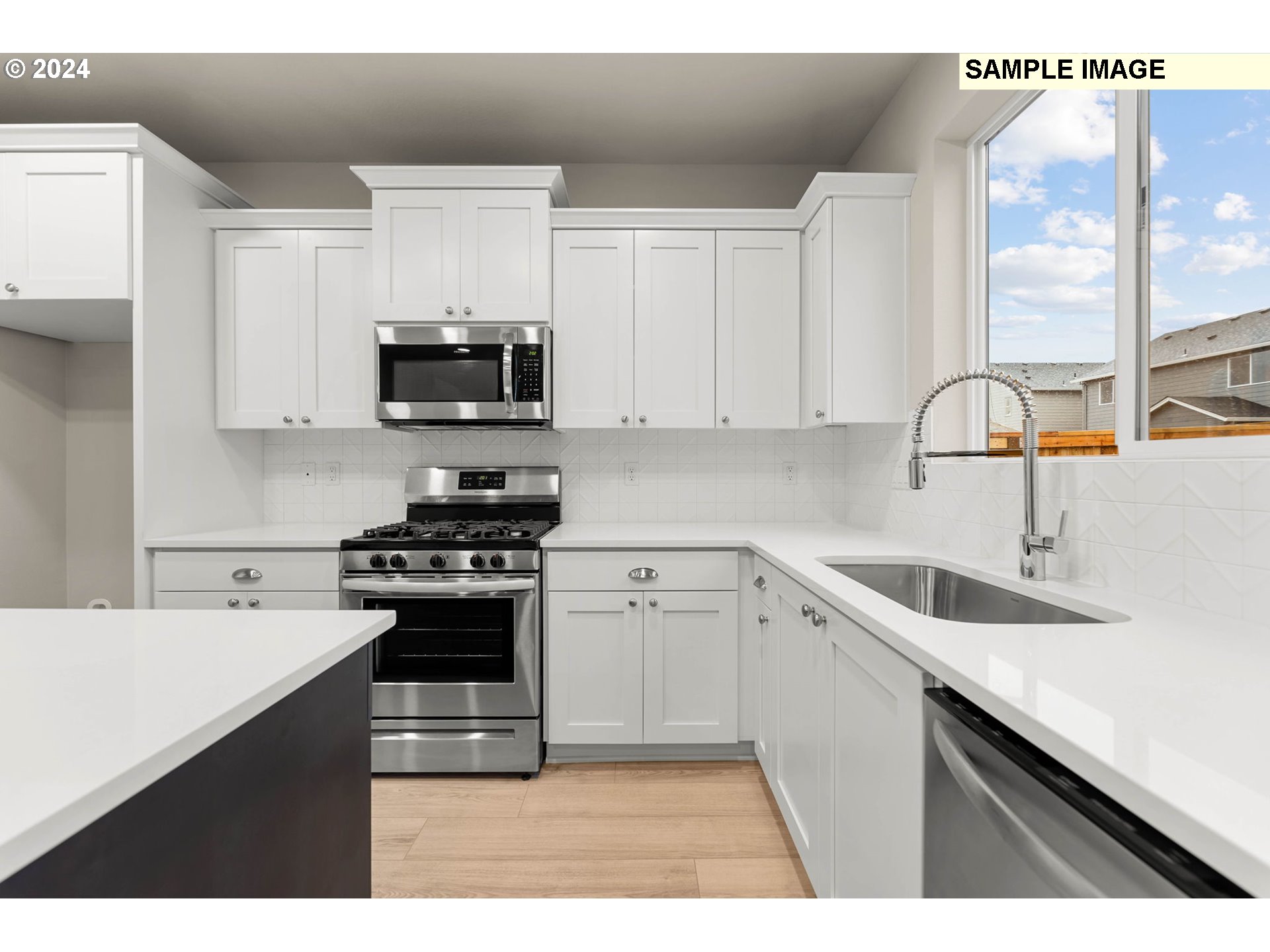 3174 South Magnolia Street, Unit LOT 755 Cornelius, OR 97113 - Photo 17 of 41 a kitchen with a sink stove top oven and cabinets