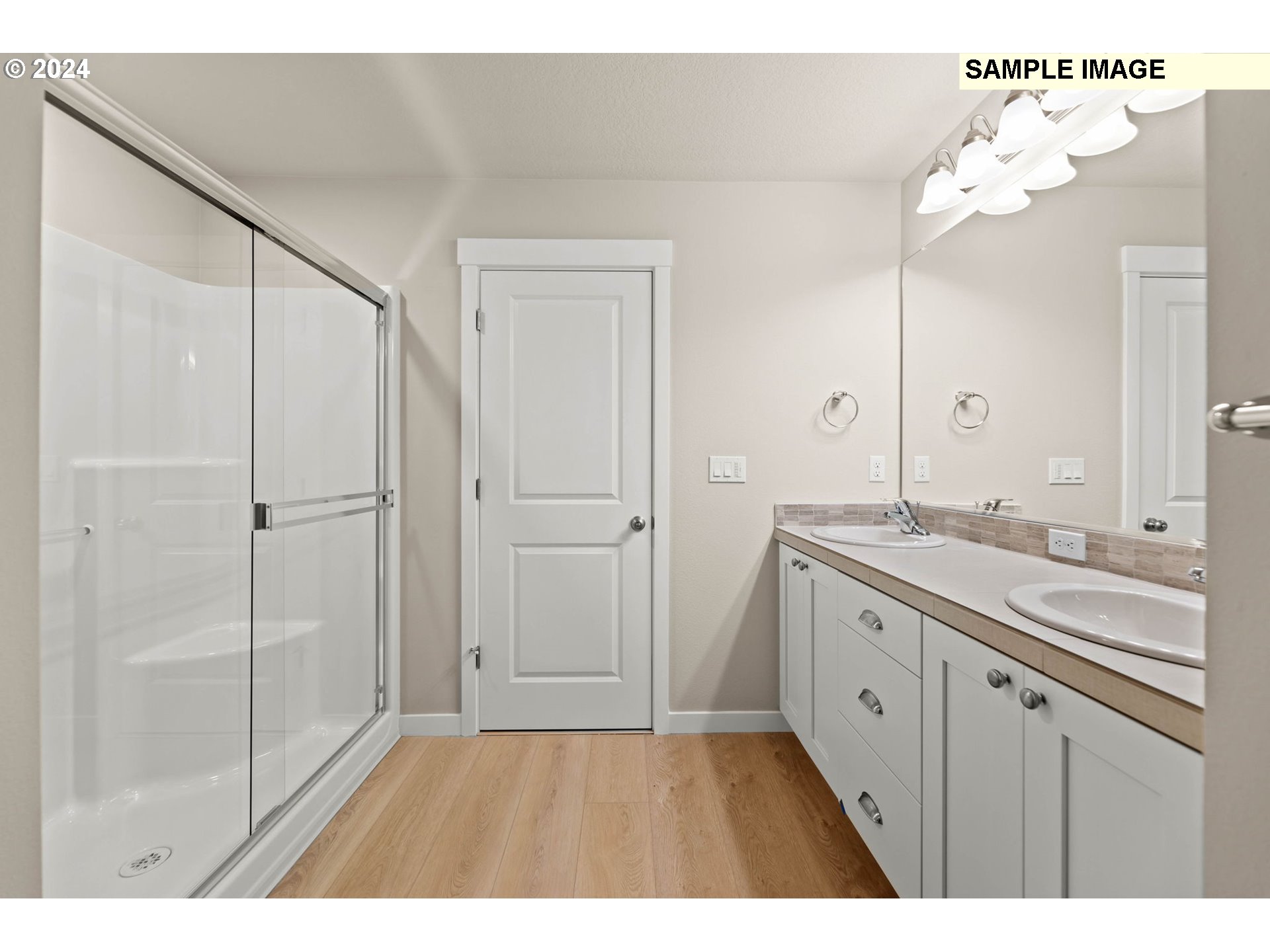 3174 South Magnolia Street, Unit LOT 755 Cornelius, OR 97113 - Photo 30 of 41 a bathroom with a double vanity sink and mirror