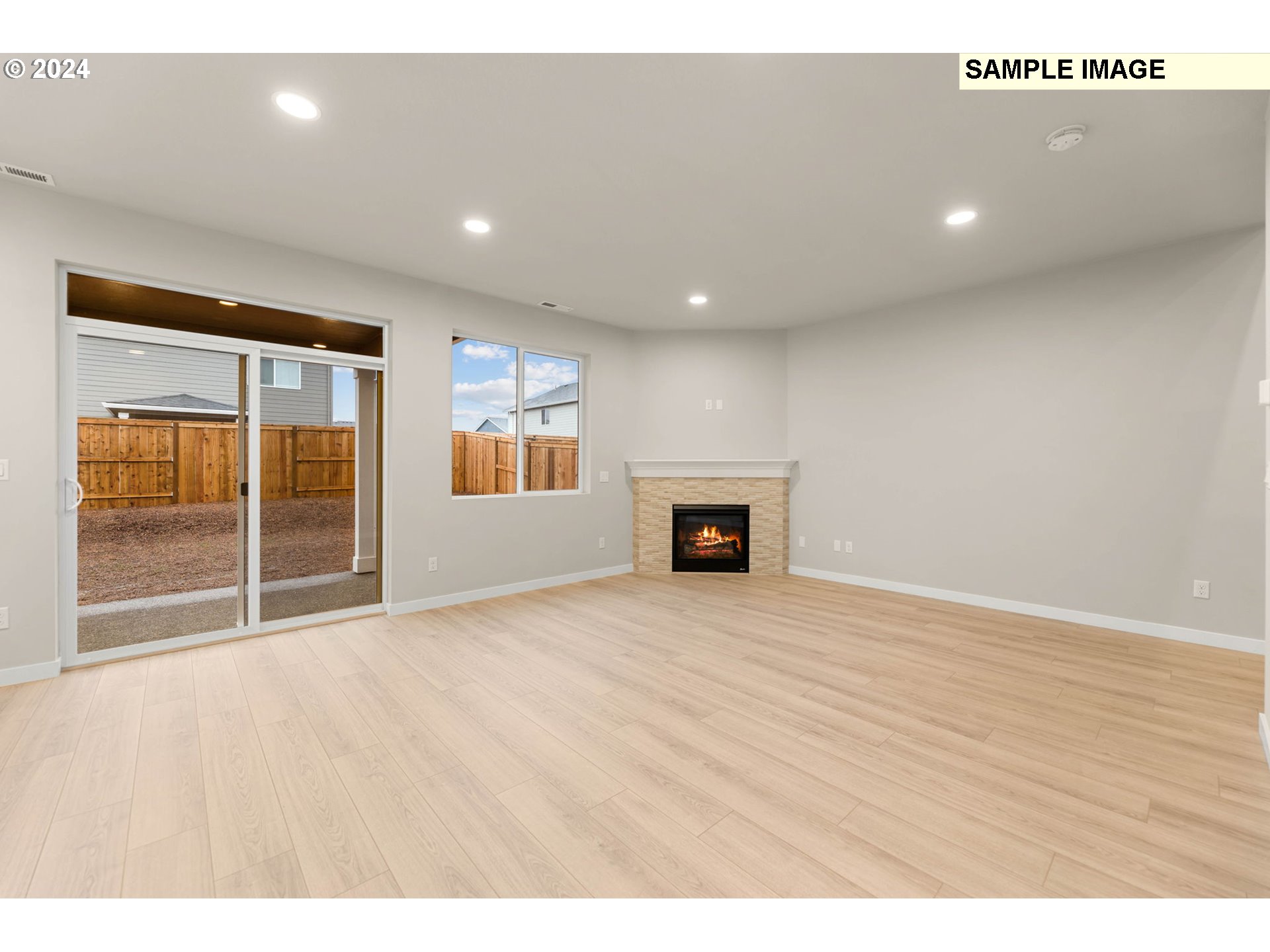3174 South Magnolia Street, Unit LOT 755 Cornelius, OR 97113 - Photo 7 of 41 a view of empty room with wooden floor and fireplace