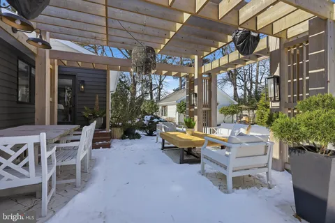 a outdoor space with lots of white furniture
