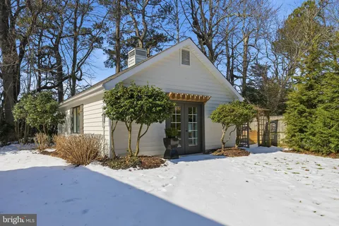 a bedroom with a bed furniture and a flat screen tv