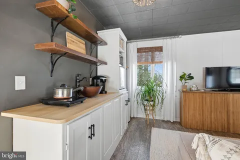 a bedroom with furniture and a potted plant