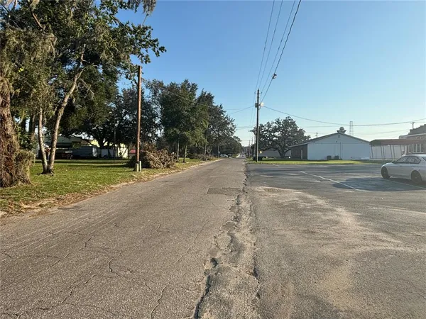 a view of a road with a building in the background