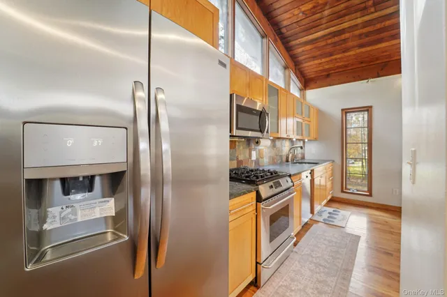 a close view of a utility room with dryer and washer