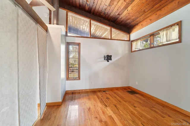 a view of hallway with wooden floor