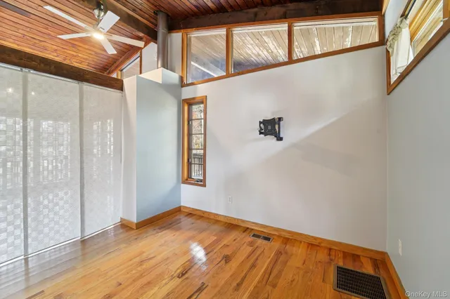 a view of a room with wooden floor
