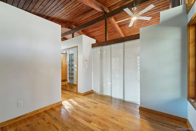 a view of a room with a wooden floor