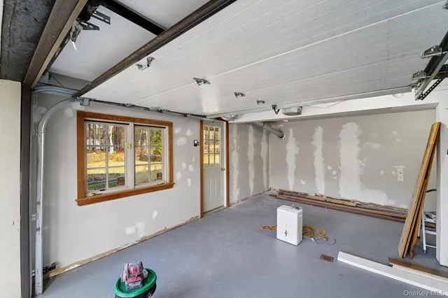 a swimming pool with outdoor seating and yard