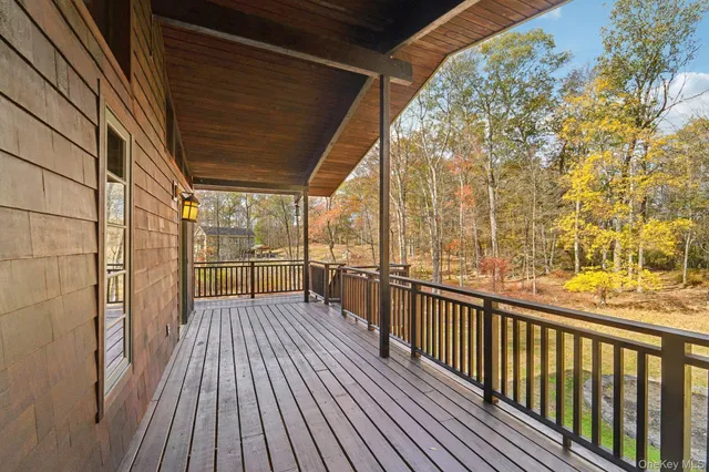 a view of a balcony with wooden floor