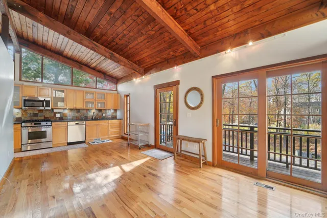 a view of a room with wooden floor