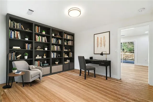 a work room with furniture and wooden floor