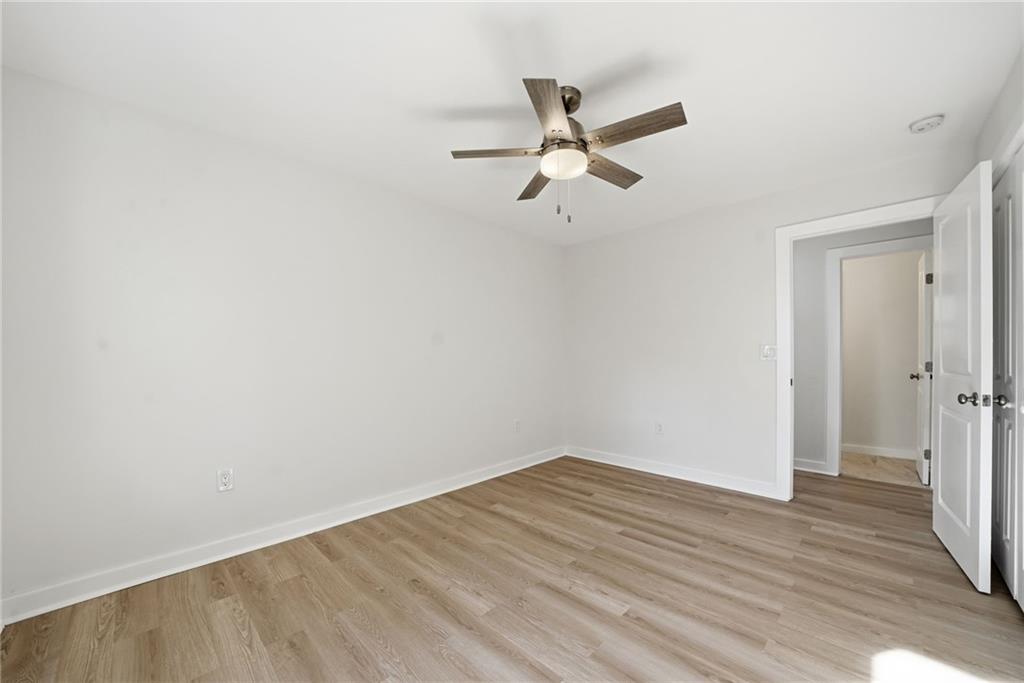 1136 Powell Court Southeast Atlanta, GA 30316 - Photo 19 of 33 a view of a big room with wooden floor and closet