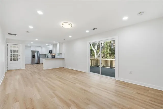 a view of a kitchen with a sink and a window