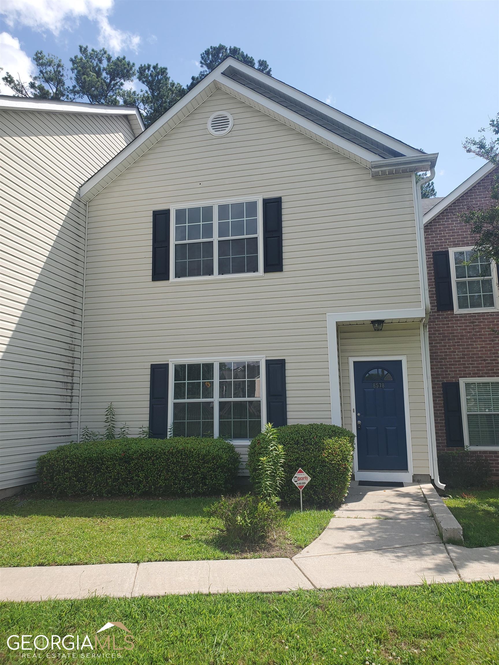 a front view of a house with a yard