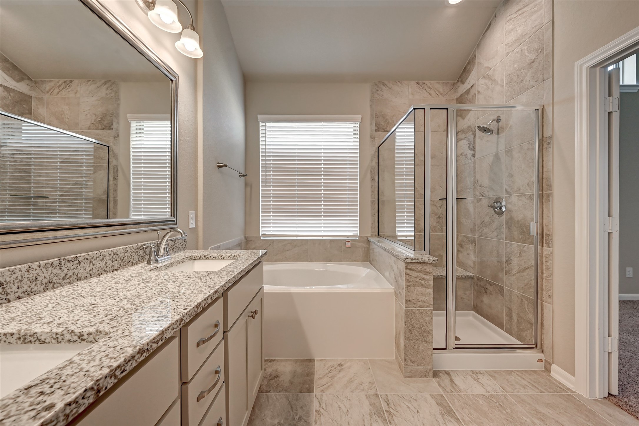 5039 Prairie Terrace Lane Fulshear, TX 77441 - Photo 10 of 16 Primary bathroom with double vanity & framed good size mirror.