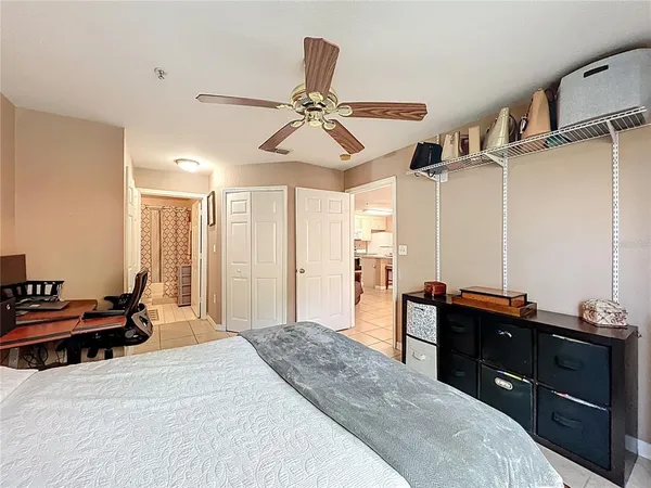 a spacious bathroom with a granite countertop toilet sink and mirror
