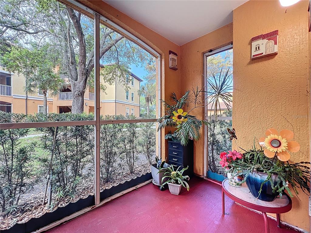 5471 Vineland Road, Unit 7109 Orlando, FL 32811 - Photo 37 of 60 a view of a chairs and table in front of a house