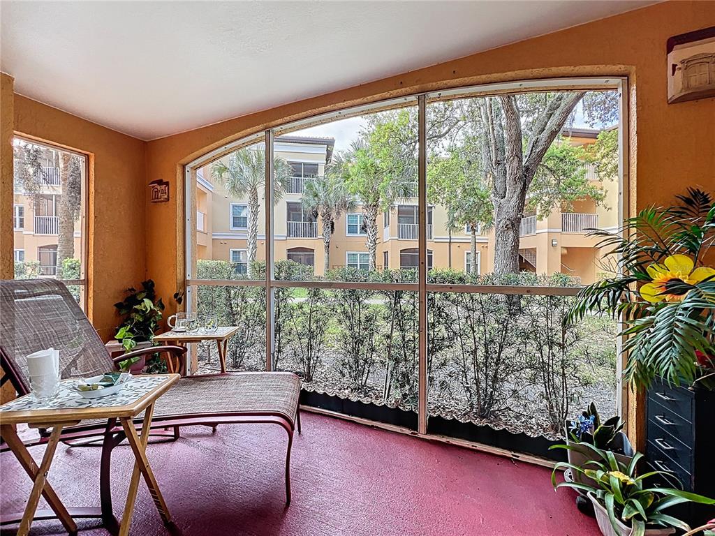 5471 Vineland Road, Unit 7109 Orlando, FL 32811 - Photo 38 of 60 a room with furniture and a large window