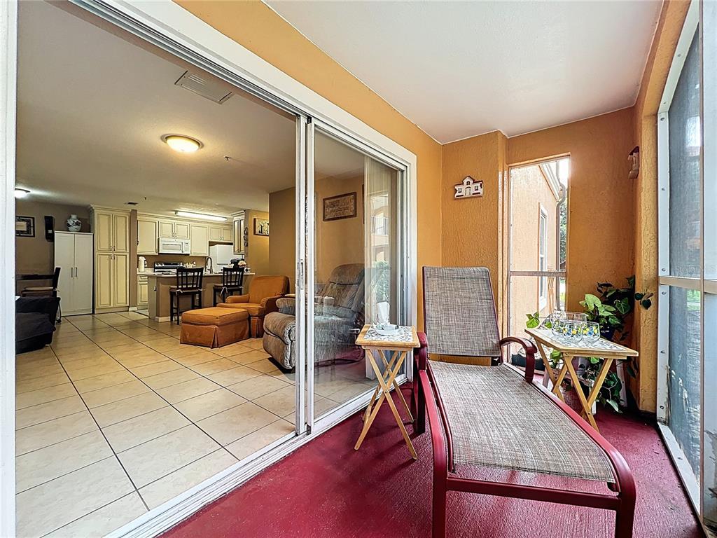 5471 Vineland Road, Unit 7109 Orlando, FL 32811 - Photo 39 of 60 a living room with furniture and large windows