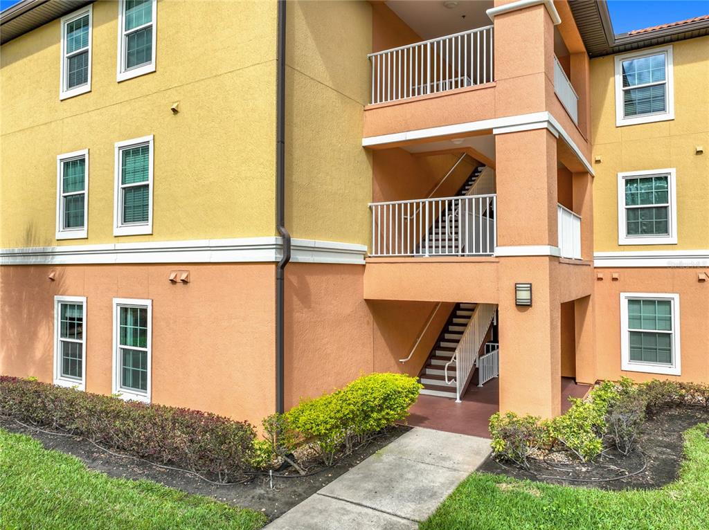5471 Vineland Road, Unit 7109 Orlando, FL 32811 - Photo 42 of 60 a front view of a house with a yard