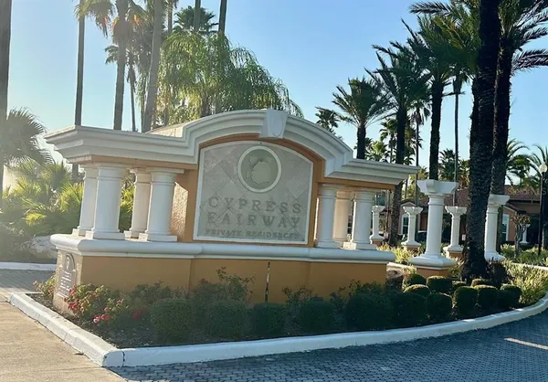 a view of a swimming pool with palm trees