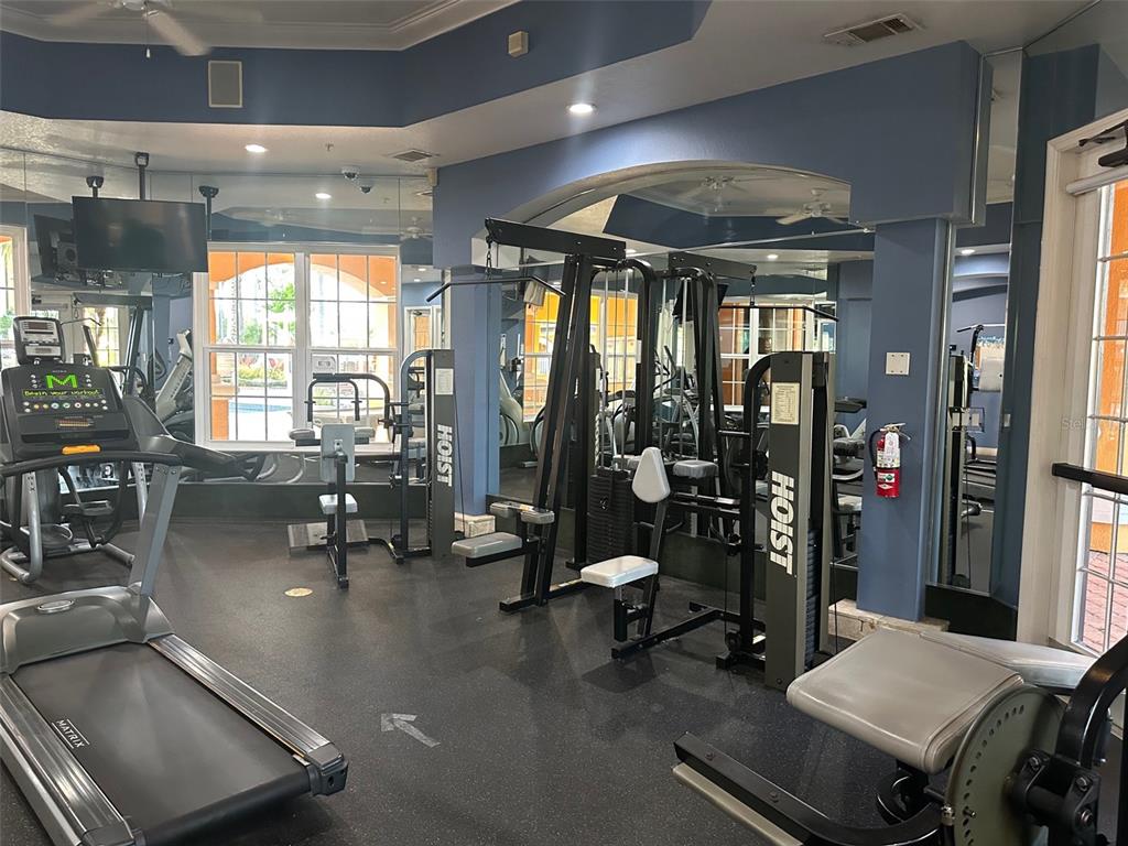 5471 Vineland Road, Unit 7109 Orlando, FL 32811 - Photo 52 of 60 a view of a room with gym equipment