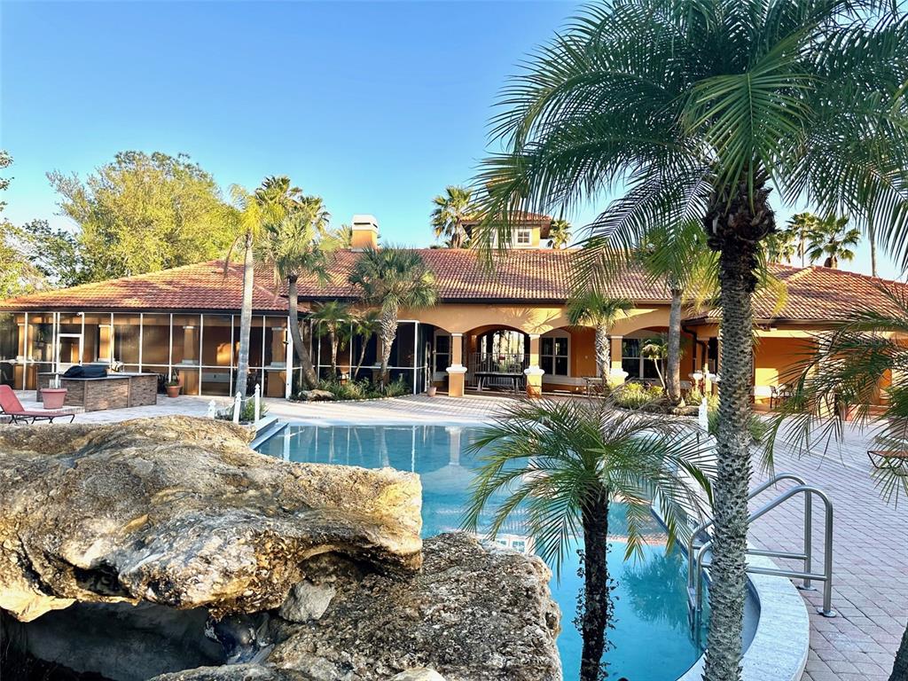 5471 Vineland Road, Unit 7109 Orlando, FL 32811 - Photo 57 of 60 a view of a house with swimming pool