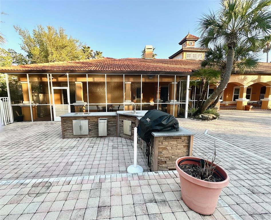 5471 Vineland Road, Unit 7109 Orlando, FL 32811 - Photo 58 of 60 a view of a house with a yard and furniture