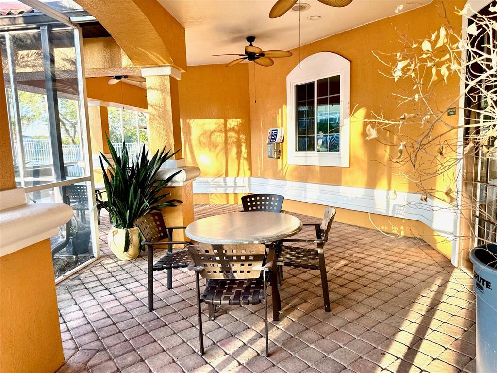 5471 Vineland Road, Unit 7109 Orlando, FL 32811 - Photo 59 of 60 a dining room with chandelier and wooden floor