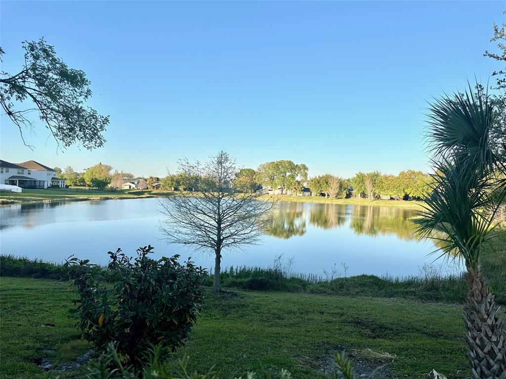 5471 Vineland Road, Unit 7109 Orlando, FL 32811 - Photo 60 of 60 a view of a lake with houses in the back