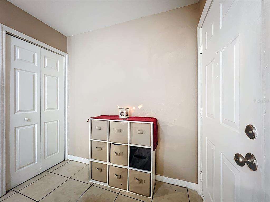 5471 Vineland Road, Unit 7109 Orlando, FL 32811 - Photo 6 of 60 a utility room with washing machine and cabinets