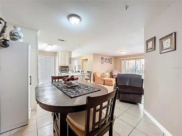 a kitchen with stainless steel appliances a stove a sink a microwave and a refrigerator