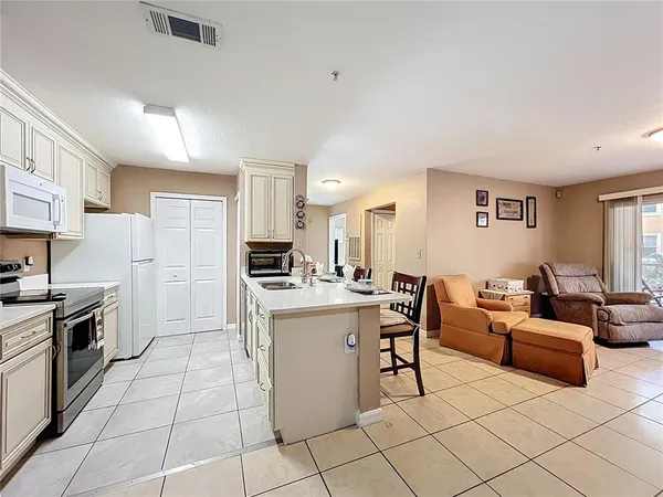 a kitchen that has a sink and a stove